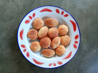 Kue Bolu or Kuih Bahulu. Bolu kering jadul. Kue Bolu, is a sponge cake baked in special aluminium moulds.