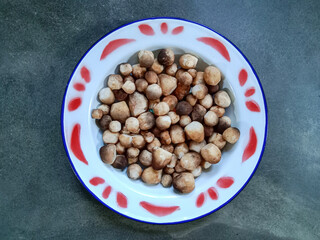 Straw mushroom (Volvariella volvacea). Fresh straw mushrooms. Straw mushrooms for cooking. Food ingredients.