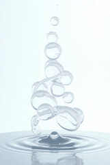 Fresh water bubbles rising upward, symbolizing purity and freshness. Ideal for concepts of hydration, cleanliness, and refreshing beverages.