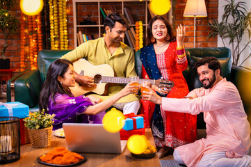 friends enjoy music on diwali, guitar, and laughter during Deepavali night at home