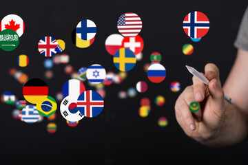 Image of a hand selecting various country flags. Ideal for global business, communication, and travel concepts.