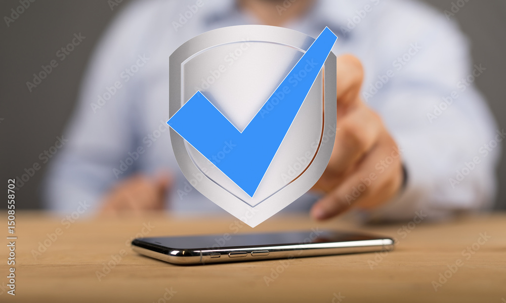 Poster Image of a person verifying mobile security with a checkmark inside a shield.  Perfect for app security, data protection, and mobile safety.