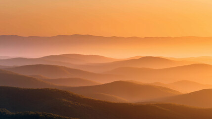 Obraz premium Soft Golden Sunrise Over Misty Hills in Early Autumn
