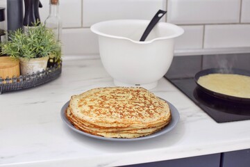 Making thin pancakes, home cooking.