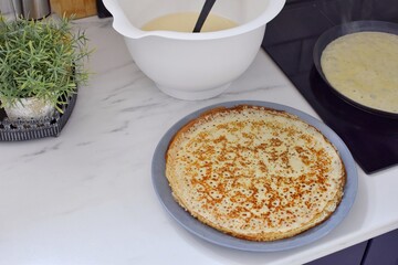 Making thin pancakes, home cooking.