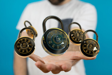 Image of hands holding multiple combination locks, symbolizing data security and protection.