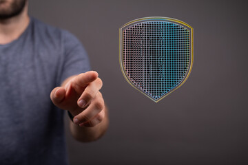 Hand reaching for a digital shield, symbolizing online security and data protection.