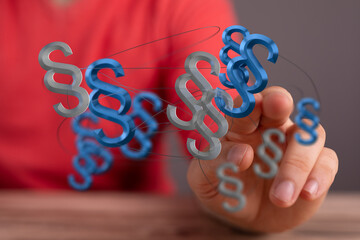 Abstract image of interconnected paragraph symbols, representing legal concepts, law, and...