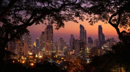 Obraz premium City skyline at twilight with illuminated buildings and trees