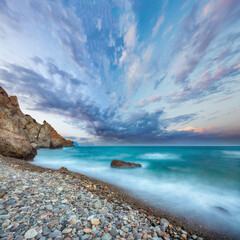 Amazing view of the beach and rocks shot with a long exposure.