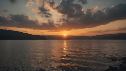Obraz premium Sunset over the lake with golden light and clouds, featuring empty copy space for text