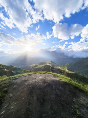 Beautiful mountain landscape with sunlight and dramatic clouds  