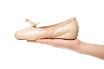 hand gently holds delicate ballet shoe isolated on white background
