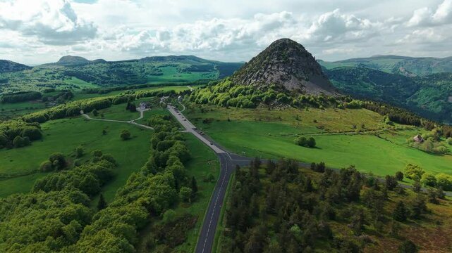 aerial shot approaching the Mont Gerber De Jonc, the source of the loire river on a beautiful day, Ardeche departement, Auvergne Rhone Alpes region, France