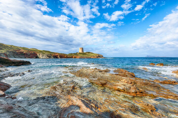 Attractive morning view  of Piscinni bay with turquoise sea and famous coastal tower of Piscinni.
