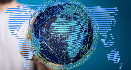 Person holding a digital globe, illustrating global connectivity and data flow.