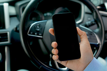 Playing with your phone while driving in a car can cause accidents.