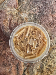 Iced coffee on brown stone