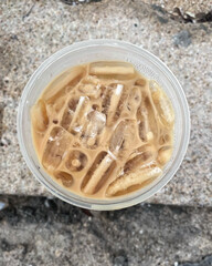 Iced coffee on brown stone