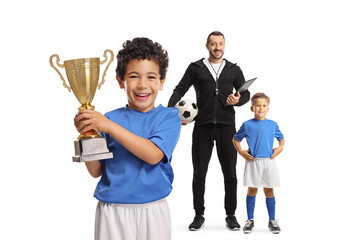 Football coach and kids with a gold trophy cup