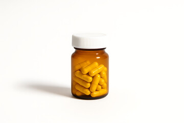 An amber prescription pill bottle filled with yellow capsules, isolated on a pure white background, shot with soft shadows for a professional stock image.