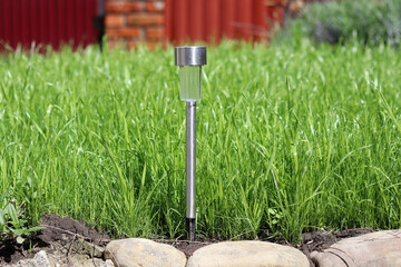 gardening tools on green grass