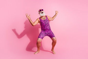 Full length photo of charismatic elderly cool man dance crazy good mood excited wear leopard print...