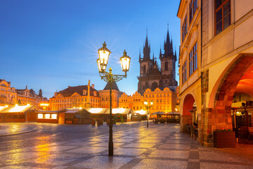 Historic Old Town Square with city buildings at dawn in Prague Czech Republic