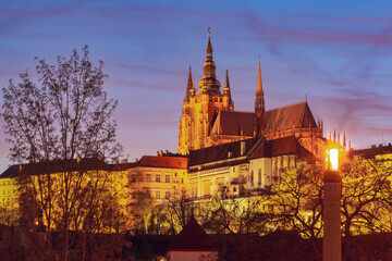 Illuminated St Vitus Cathedral at sunset in Prague Czech Republic