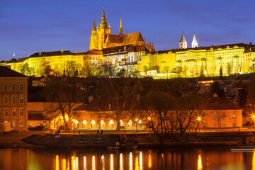 Illuminated St Vitus Cathedral at sunset in Prague Czech Republic