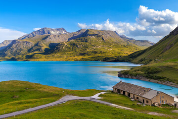 A panoramic view of the Mont Cenis Lake and French Alps under beautiful sky.