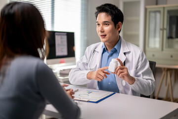 A doctor is talking to a woman in a medical office