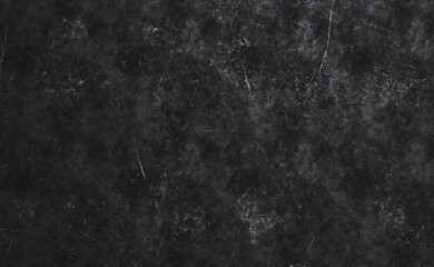 Dark textured surface with subtle scratches and discoloration, exhibiting a worn and aged...