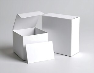 Naklejka premium Two blank white boxes and a card, one open