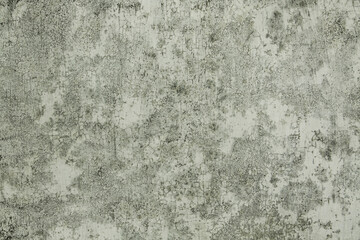 Detailed texture of an old, weathered concrete wall with cracked and peeling surface. Ideal for...