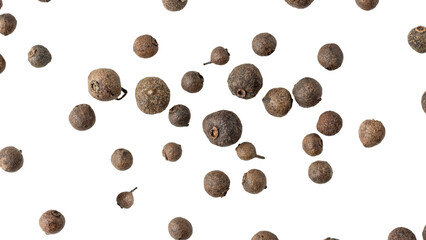 Dried whole allspice berries closeup flying isolated on white background. Aromatic spicy ingredient for cuisine.