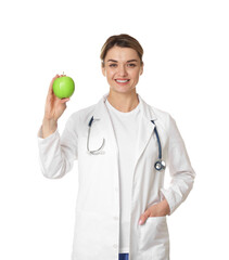 Nutritionist with green apple and stethoscope on white background