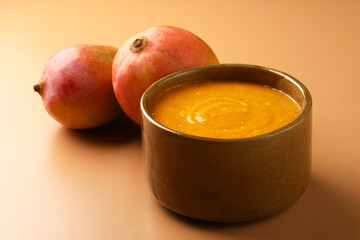 Mango pulp or Aam Rus served in a ceramic bowl