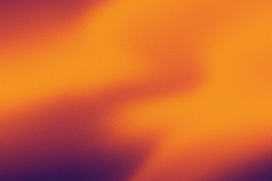 Abstract dreamy noise gradient background in vibrant fusion of yellow and orange hues creates a dynamic fluid texture