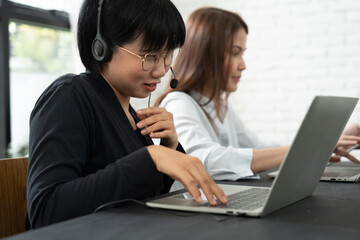 A visually impaired woman collaborates seamlessly with her colleagues, proving that teamwork and...
