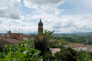 View of Peccioli bell tower and surrounding countryside . Pisa, Tuscany Italy