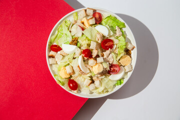 Delicious Caesar Salad with Fresh Ingredients on a White Plate