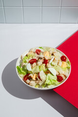 Delicious Caesar Salad with Fresh Ingredients on a White Plate
