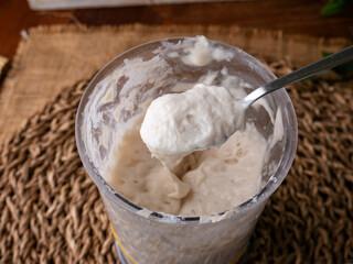 Bubbly sourdough starter in glass jar. Active yeast for bread making