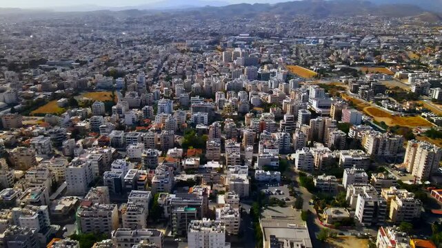 Evening sunset over Limassol, Cyprus. Aerial view of modern urban architecture and glass skyscrapers of Cyprus. Mediterranean Sea near Limassol, Cyprus. High quality footage 4k