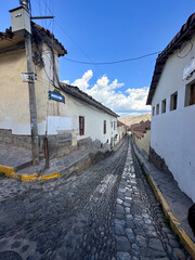 Panoramic views of the iconic cobblestone streets in the beautiful city of Cusco, Peru. A charming historic cityscape with colonial architecture, Inca heritage, and rich cultural atmosphere in the hea