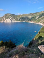 Fototapeta premium Beautiful coastal mountain views blue waters white sandy beaches Kefalonia Greece on a sunny day 
