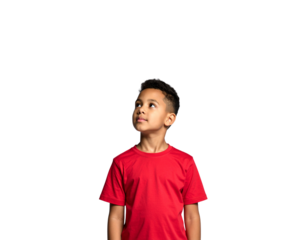 Young boy with a red shirt looking up with curiosity and wonder