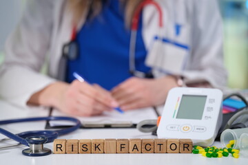A qualified medical professional examines risk factors affecting patient health using advanced monitoring equipment