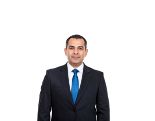 Confident businessman in dark suit and vibrant blue tie looking directly at the camera